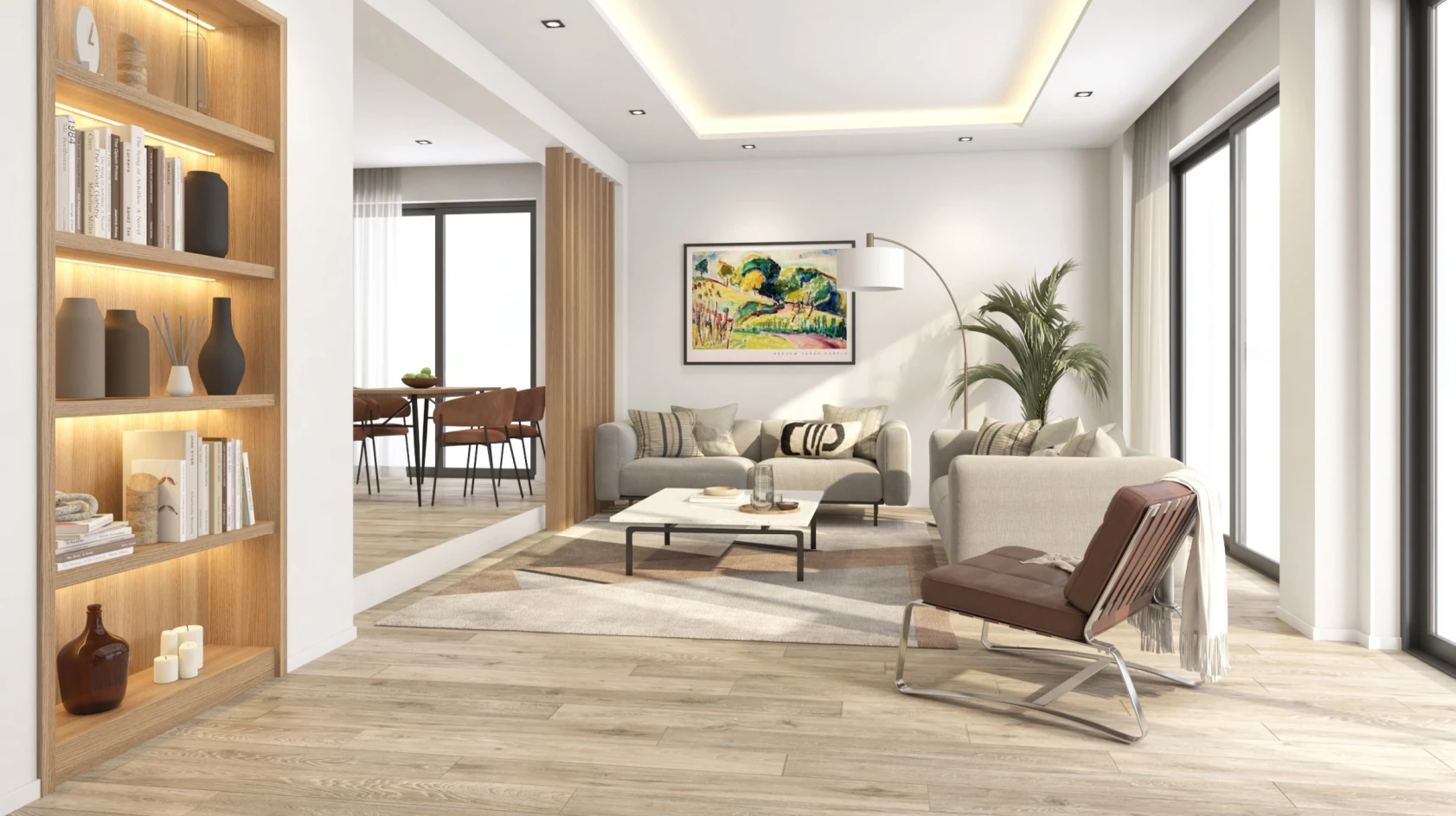 Modern bir oturma odası iç mekanında, açık tonlarda duvarlar ve geniş pencerelerle aydınlık bir atmosfer yaratılmış. Odanın bir köşesinde şık bir kitaplıkta dekoratif objeler ve kitaplar yer alıyor. Rahat bir oturma takımı, kahverengi bir koltuk ve modern bir sehpa ile beraber konumlanmış. Duvara asılı, renkli bir sanat eseri dikkat çekiyor. Bitkilerle desteklenen doğal bir görünüm, oda genelinde ferahlık katıyor. Yeme alanı, oturma odasına açık şekilde tasarlanmış; ahşap masa ve sandalyeler onun yanında yer alıyor.